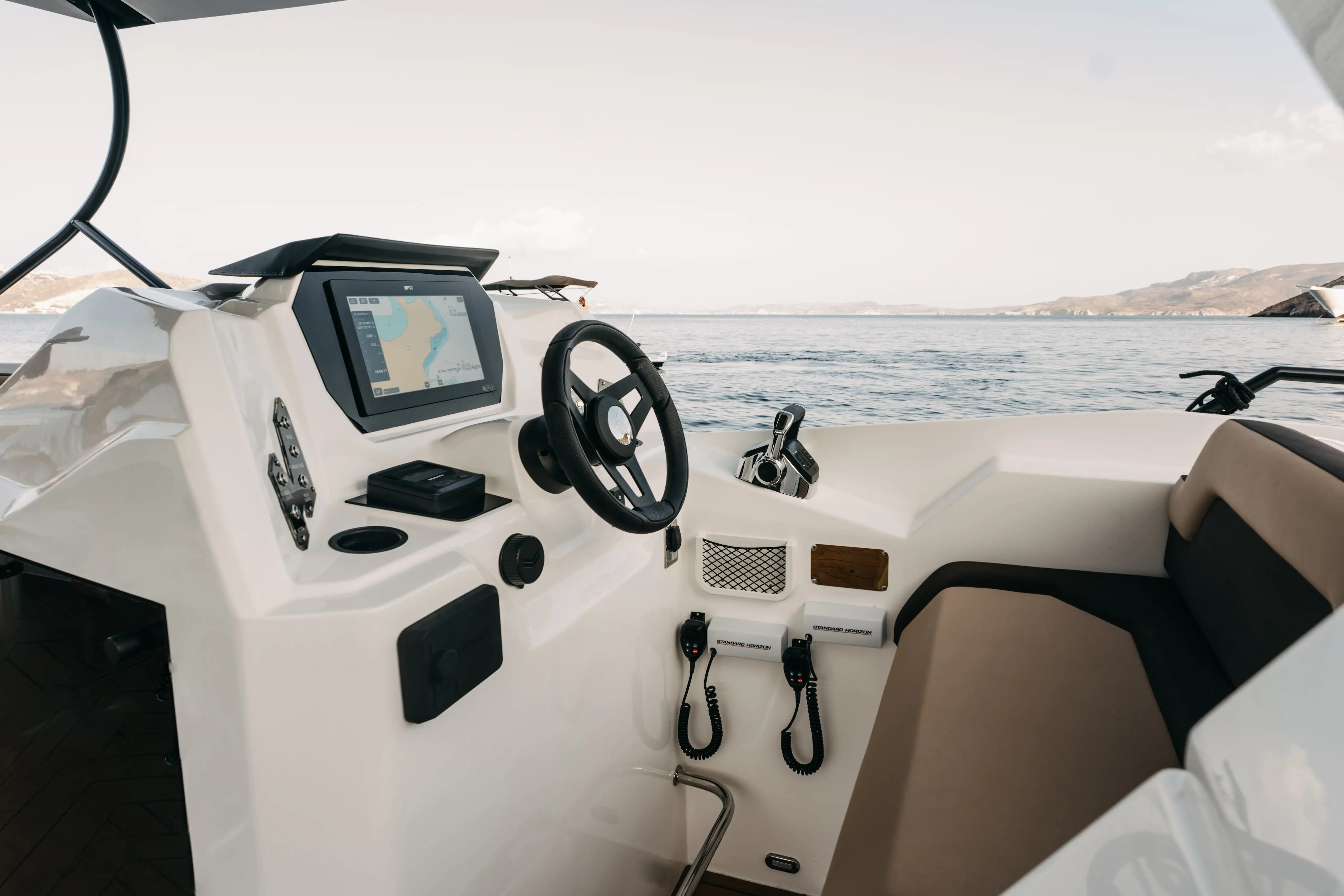 Helm station with touchscreen navigation and steering controls on the Navy Blue Raptor