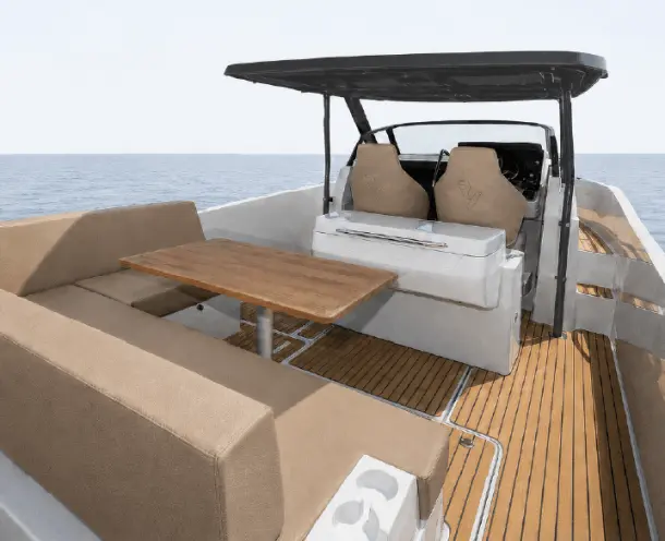 Ryck luxury open-yacht cockpit with teak deck by Navy Blue, beige lounge seating and dining table
