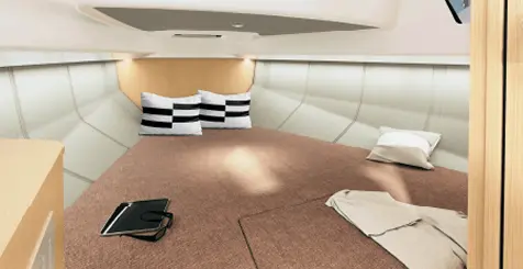 Ryck luxury open-yacht cabin by Navy Blue with double berth, beige upholstery and striped cushions