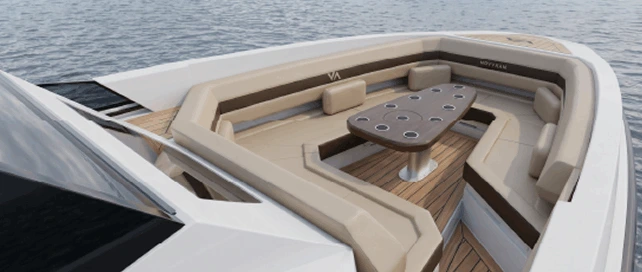 Navygon open-yacht bow by Navy Blue with a wide beige cushioned sunpad and calm blue sea stretching to the horizon