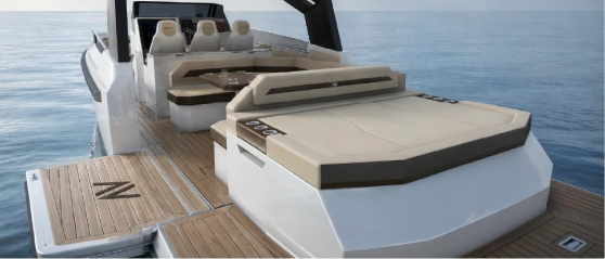 Navygon luxury yacht by Navy Blue aft deck with large sunpad, dinette and triple helm seats, teak platform