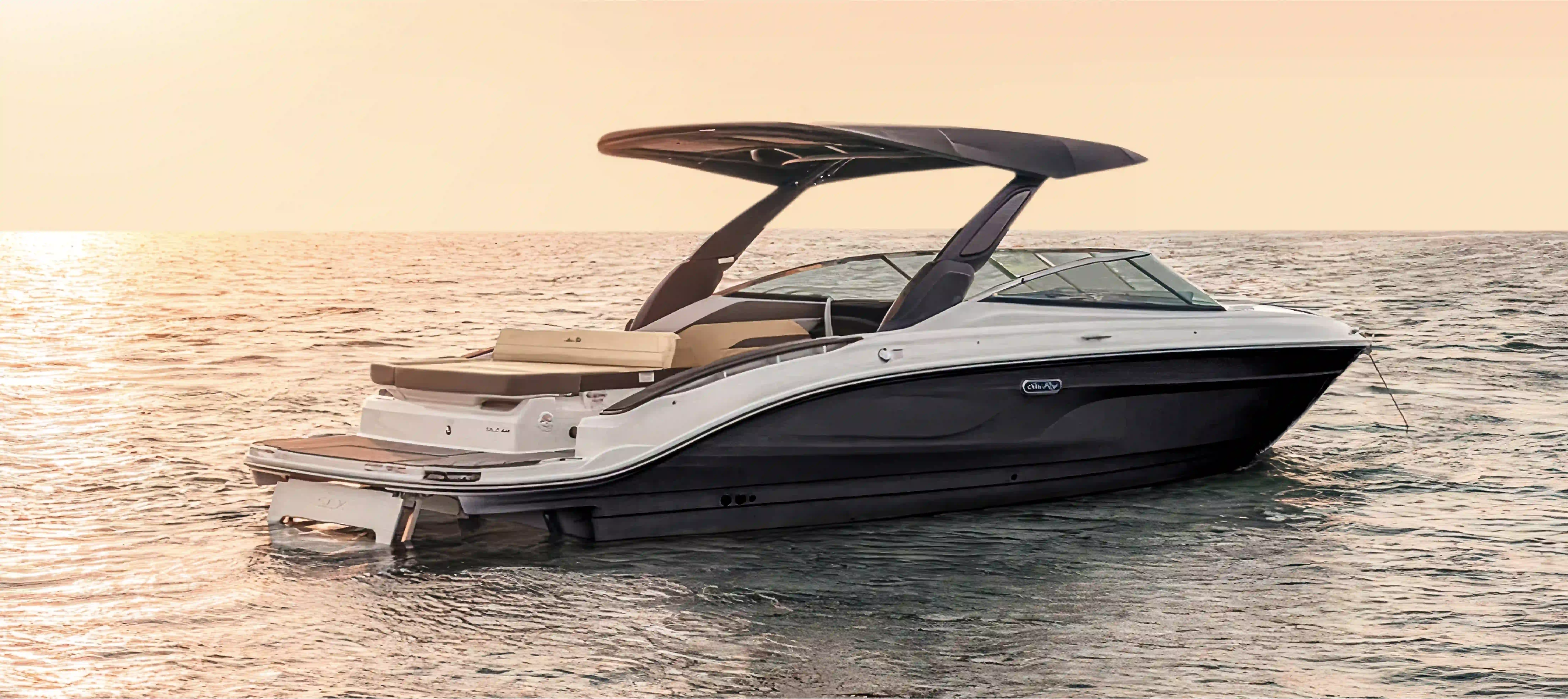 Navy Blue Sea Ray SDX 250 open-yacht with bimini shade at sunset, luxury vessel for Private Cruises in Milos