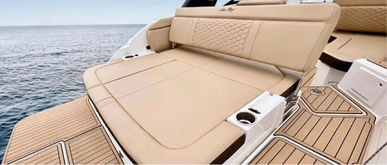 Navy Blue Sea Ray stern sun pad with plush cushioning and teak deck for cruises in Milos