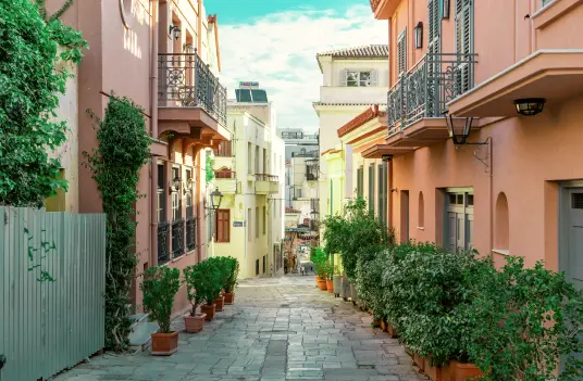 Cobblestone street in the old Plaka neighborhood of Athens, departure city for Navy Blue Sea Transfers to Milos.