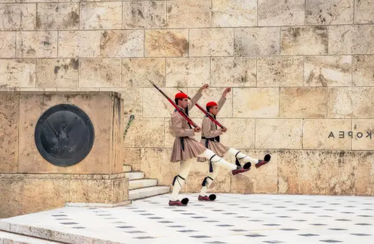 Evzones of the Presidential Guard at Syntagma Square in Athens, departure city for Navy Blue Sea Transfers to Milos.