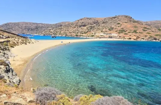 The Kolona sandbar on Kythnos, a narrow strip of sand with a bay of turquoise water on each side