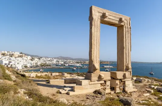 The Portara, the ancient marble temple gate on Naxos, overlooking Naxos Town and the harbor