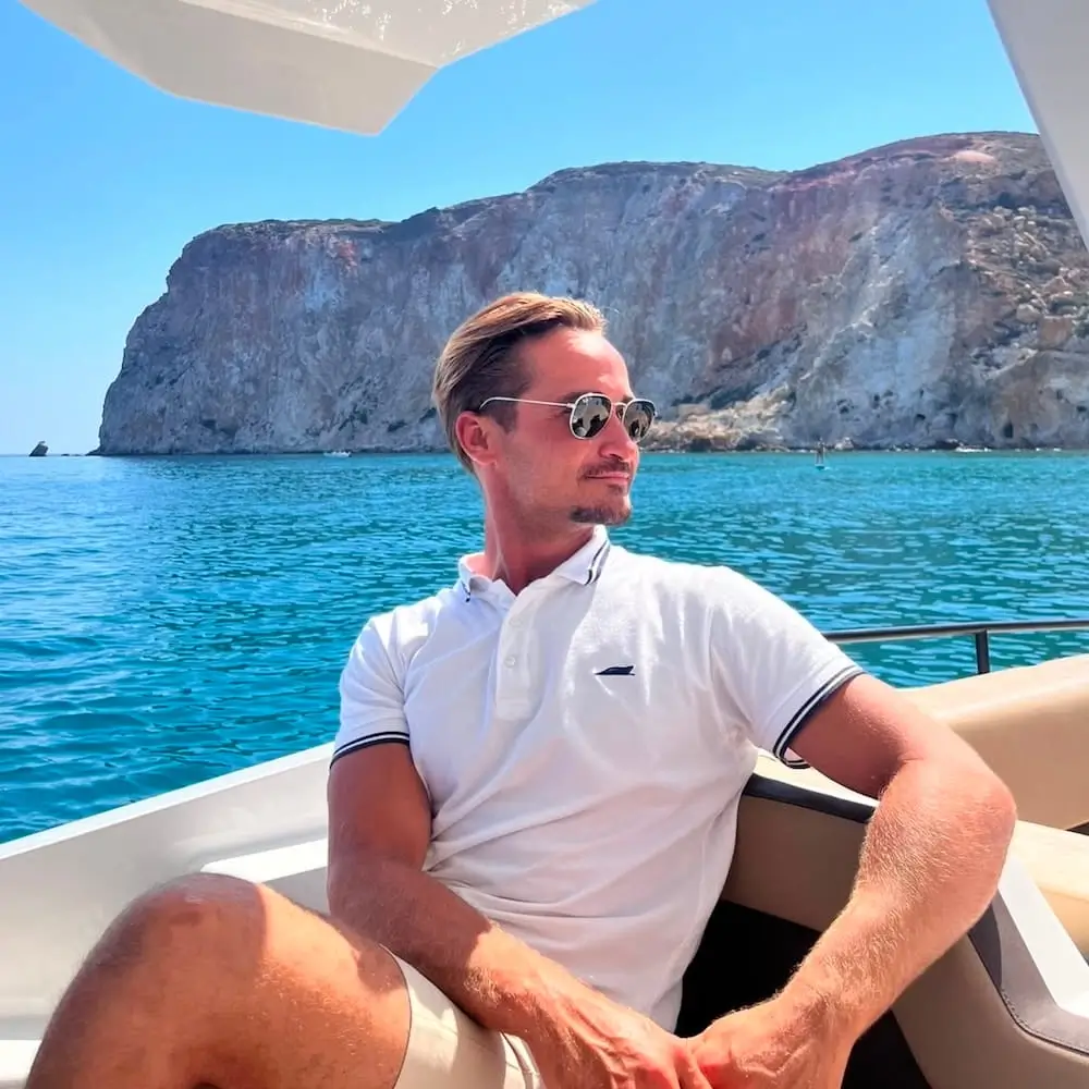 Gerasimos Manthou, Navy Blue captain, on deck during a cruise in the Cyclades near Milos