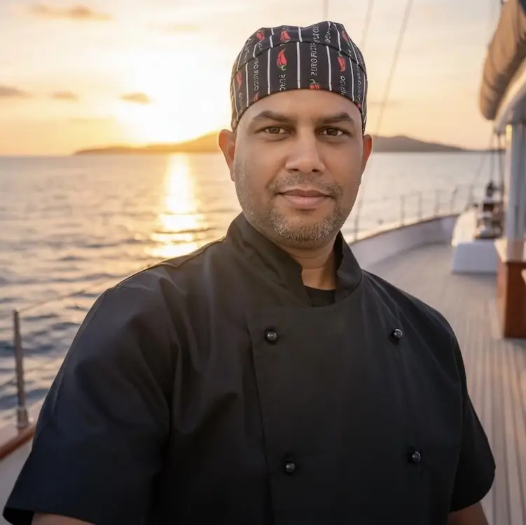 Hossein, Navy Blue head chef preparing Greek and Mediterranean dishes for cruises in Milos