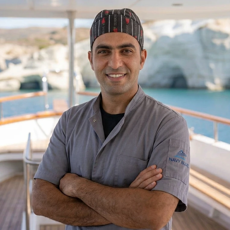 Ibrahim, Navy Blue chef preparing fresh Greek island dishes for cruises in Milos