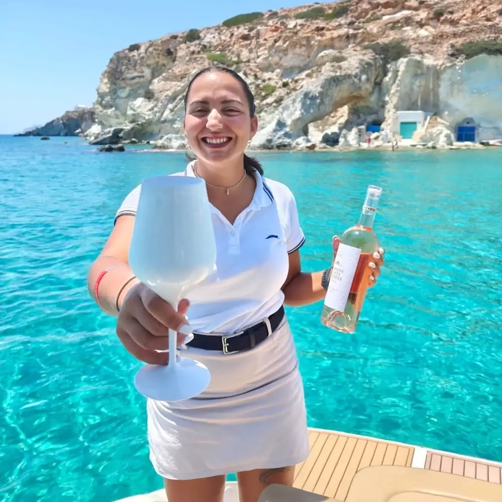 Niki Moustaka, Navy Blue host, welcoming guests during a cruise around Milos